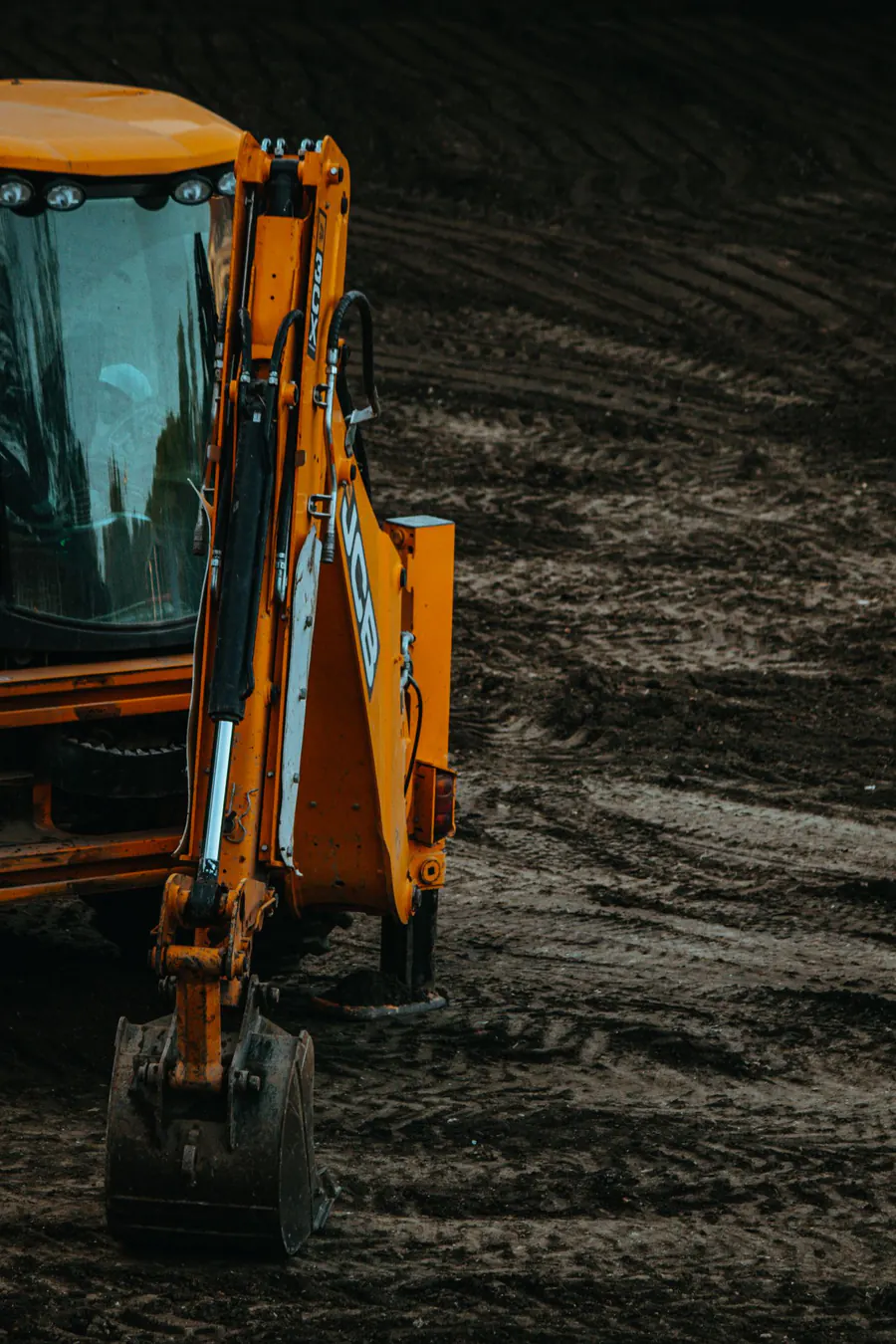 Earthmoving equipment preparing a construction site