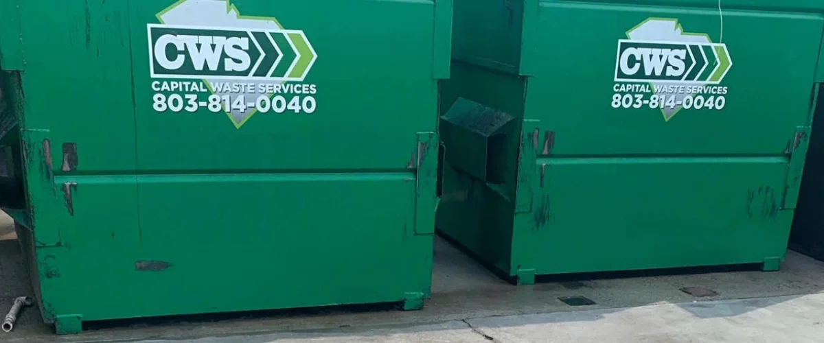 Two large green CWS Capital Waste Services dumpsters with phone number, featuring the South Carolina logo.