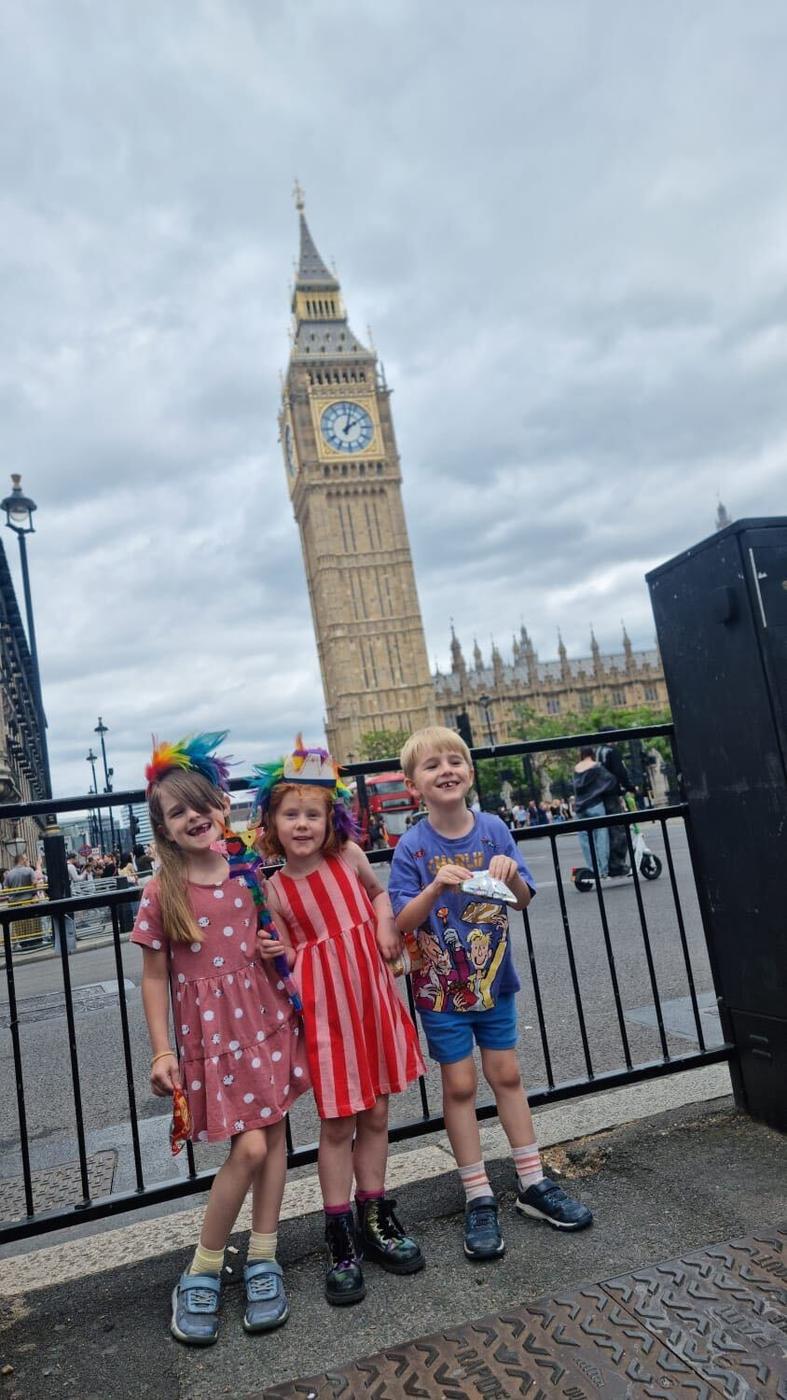 Three children on a trip to Westminster during an on-site holiday club