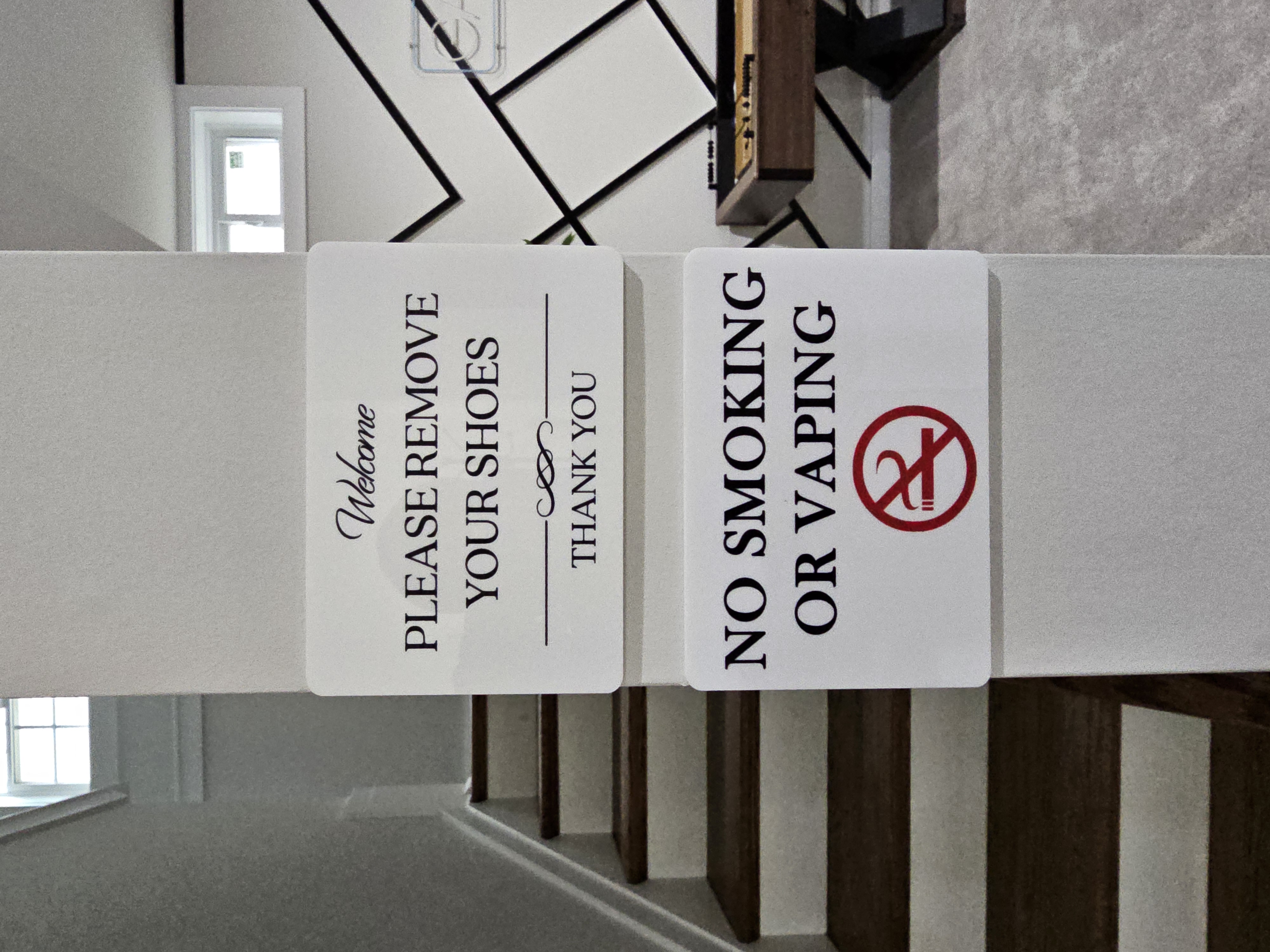 House rules sign — no smoking, no vaping, no weed, no shoes inside