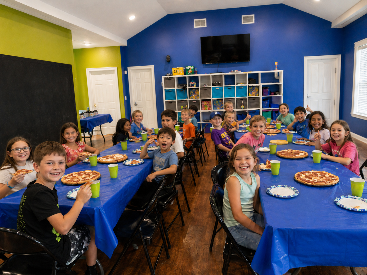 Kids celebrating at a pizza party