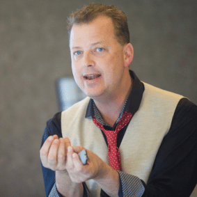Motivational Speaker Tyler Hayden at TEDx event Holding X from Tedx Argyle. St