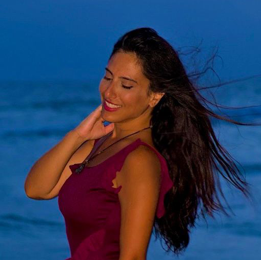 Woman on beach in red dress