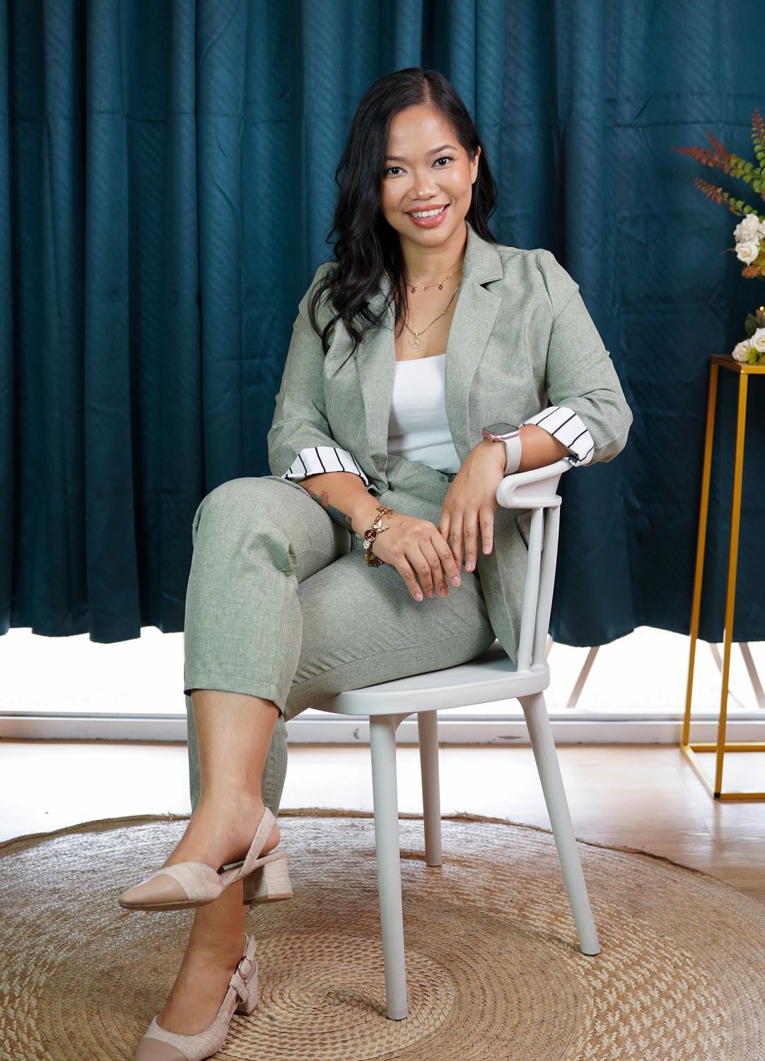 Annikka seated on a chair