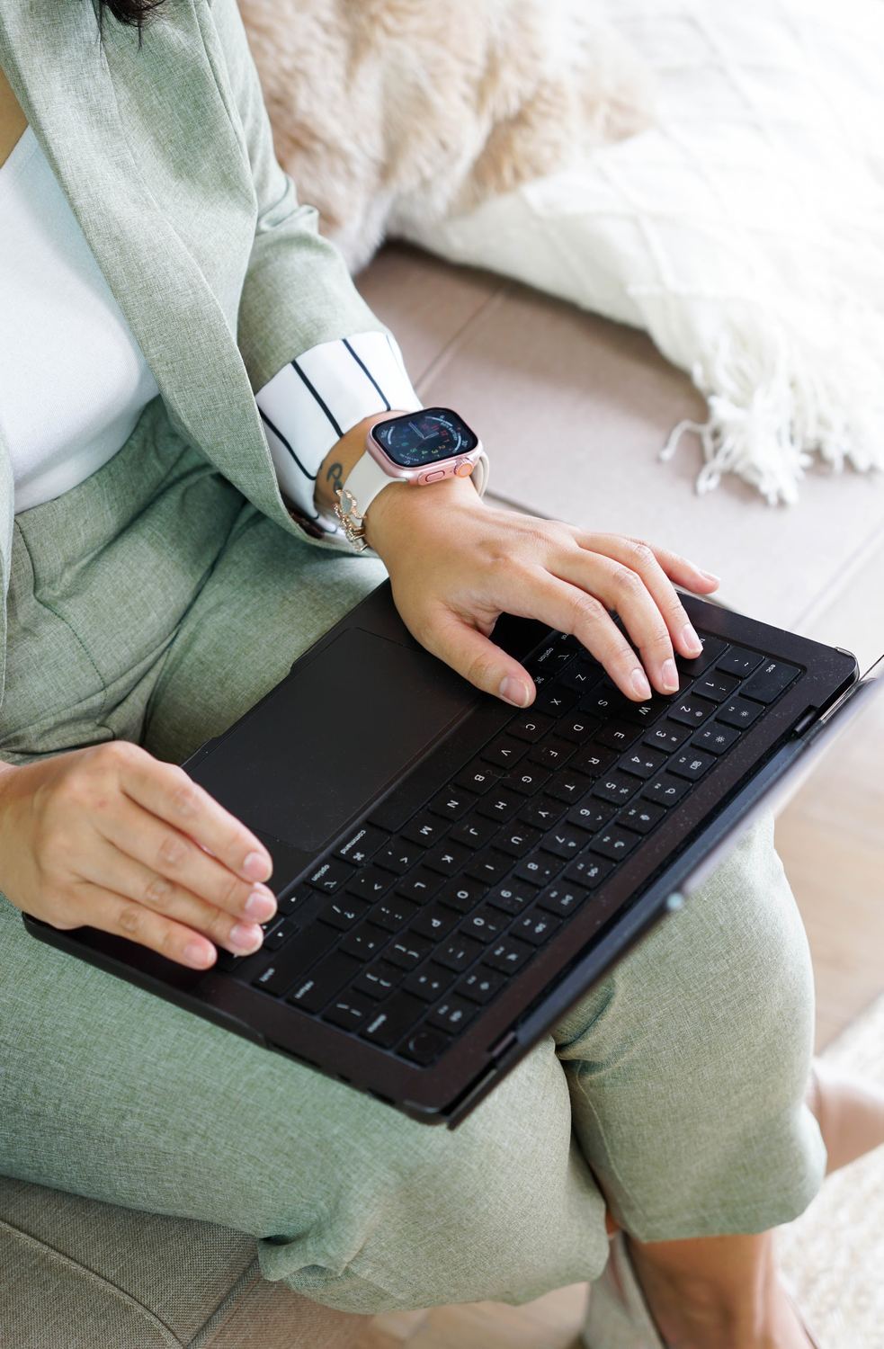 Hands typing on a keyboard