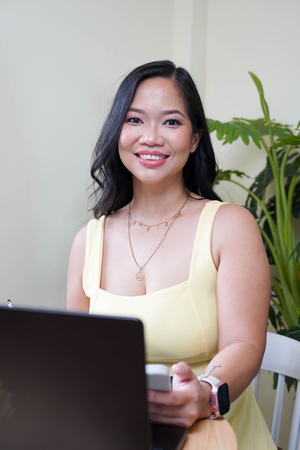 Annikka at her desk with her phone