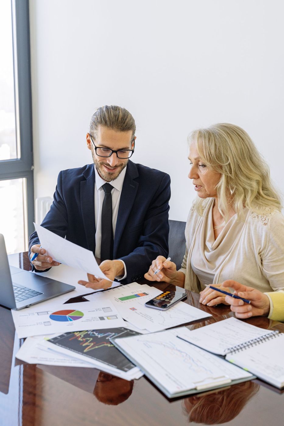 Reviewing business charts and reports