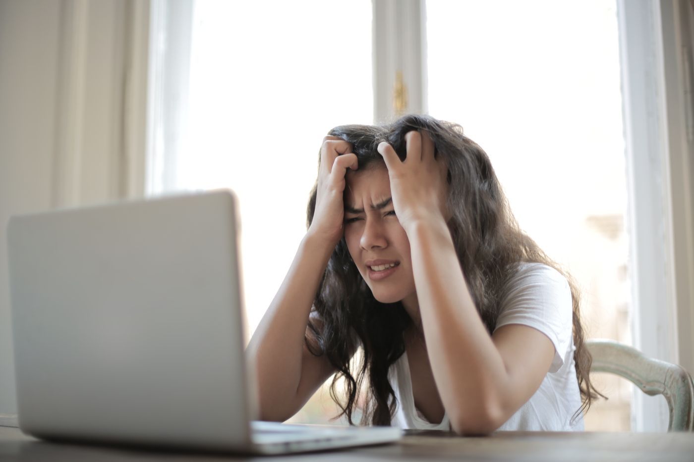Stressed founder at her laptop