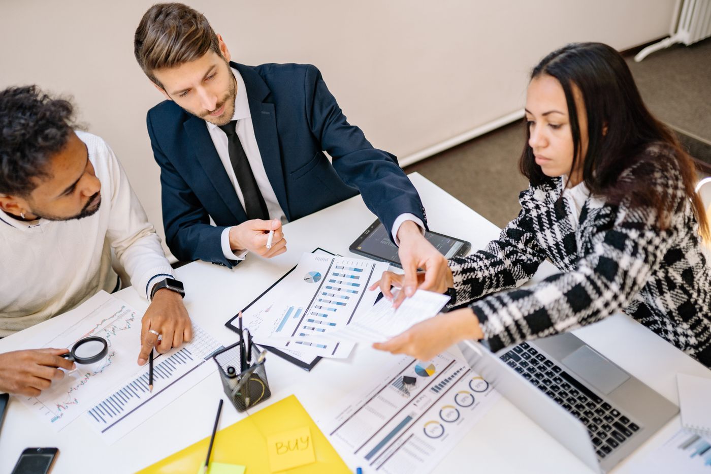 A team reviewing progress on a chart