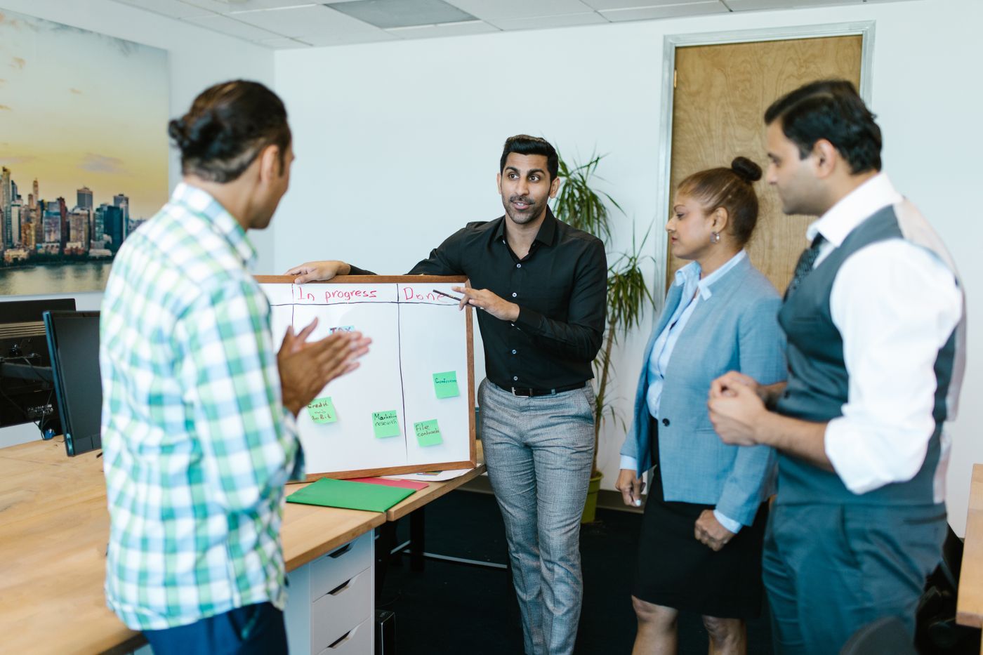 A team reviewing progress on a chart