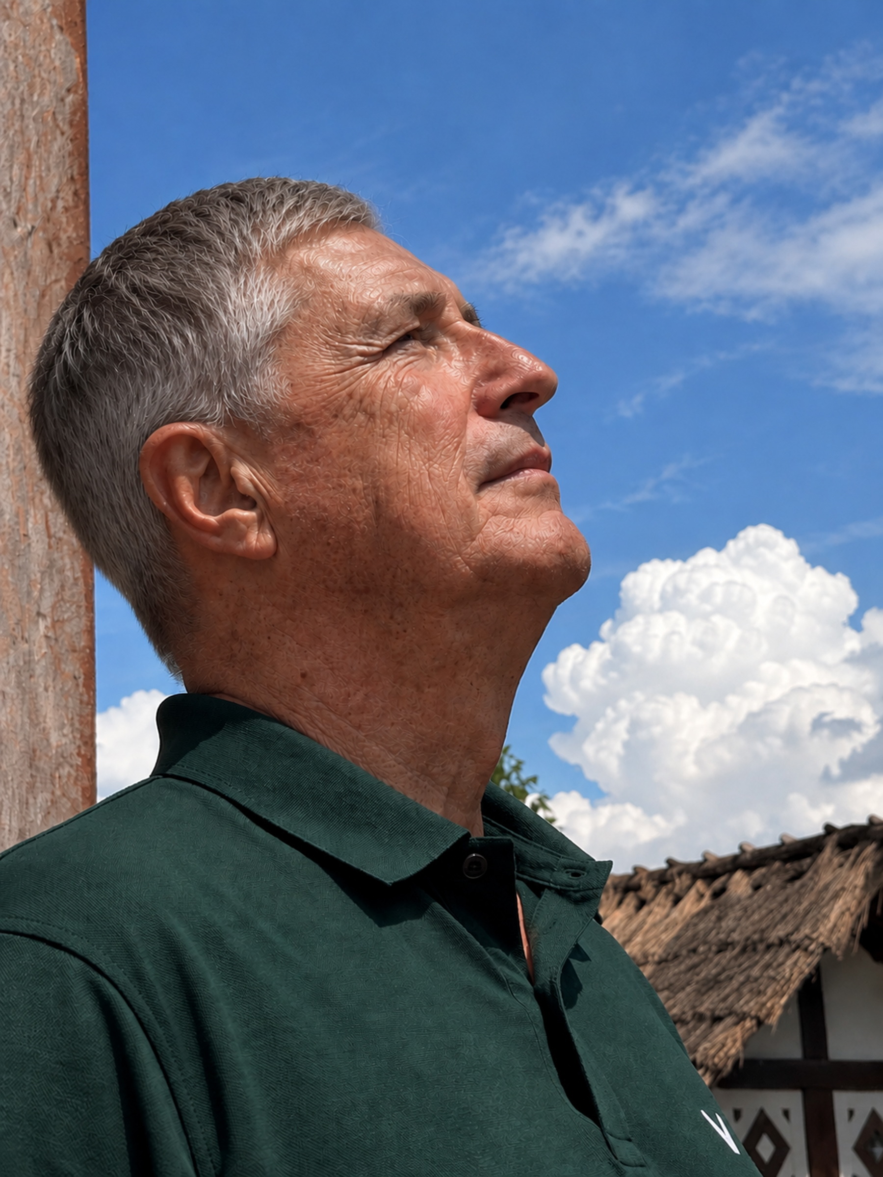 Doug in Thailand, looking up toward the sky.