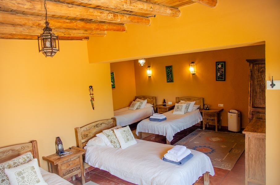 Dorm room with single beds at Suryalila Retreat Centre