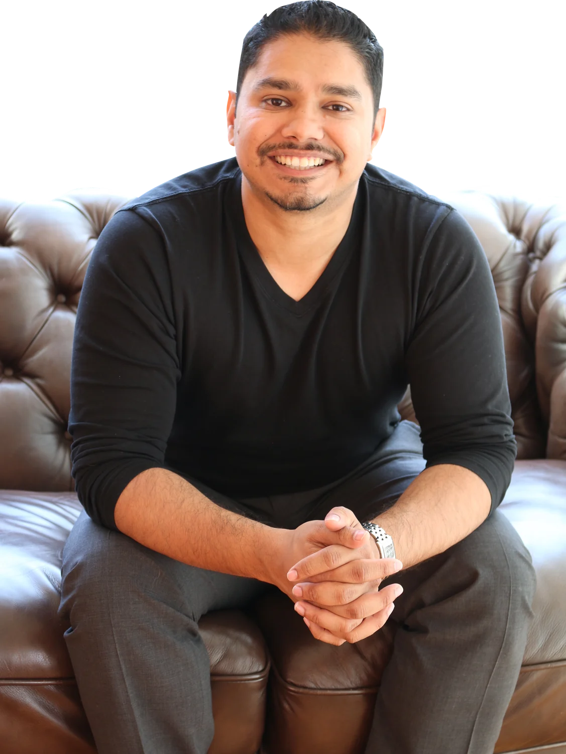 Johann Nogueira seated, smiling