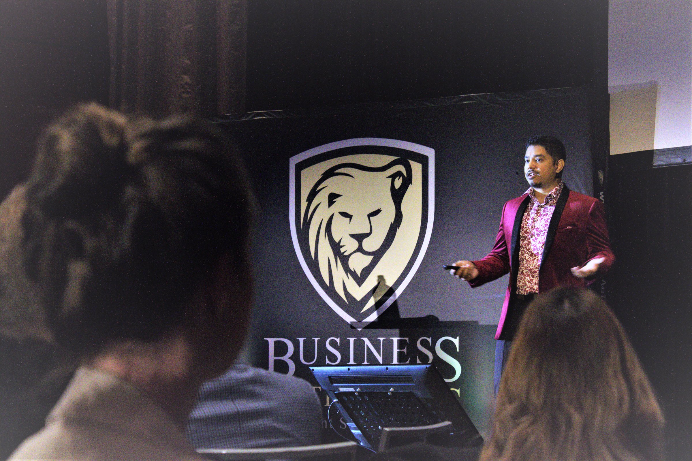 Johann Nogueira speaking on stage at a Business Authorities masterclass