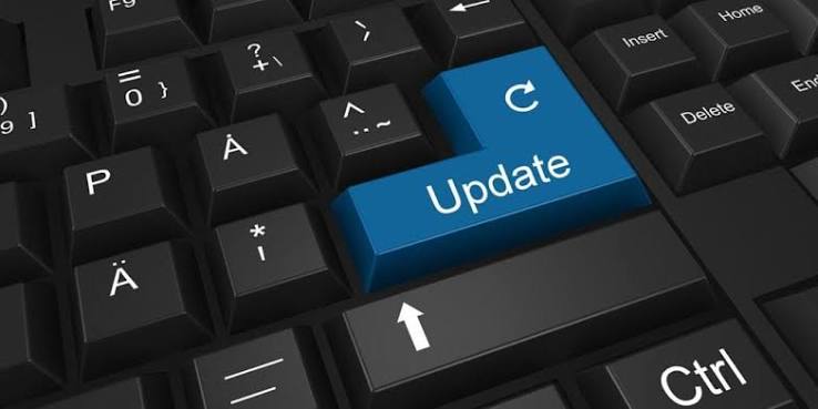 a keyboard that shows the word Update on a blue key a keyboard that shows the word Update on a blue key