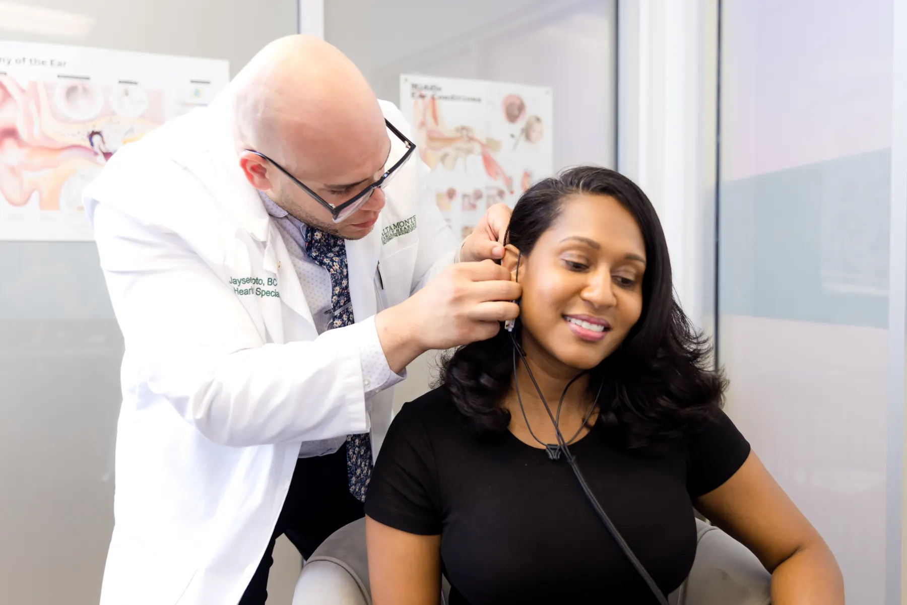 Jaysee positioning equipment at a patient's ear during Real Ear Measurement