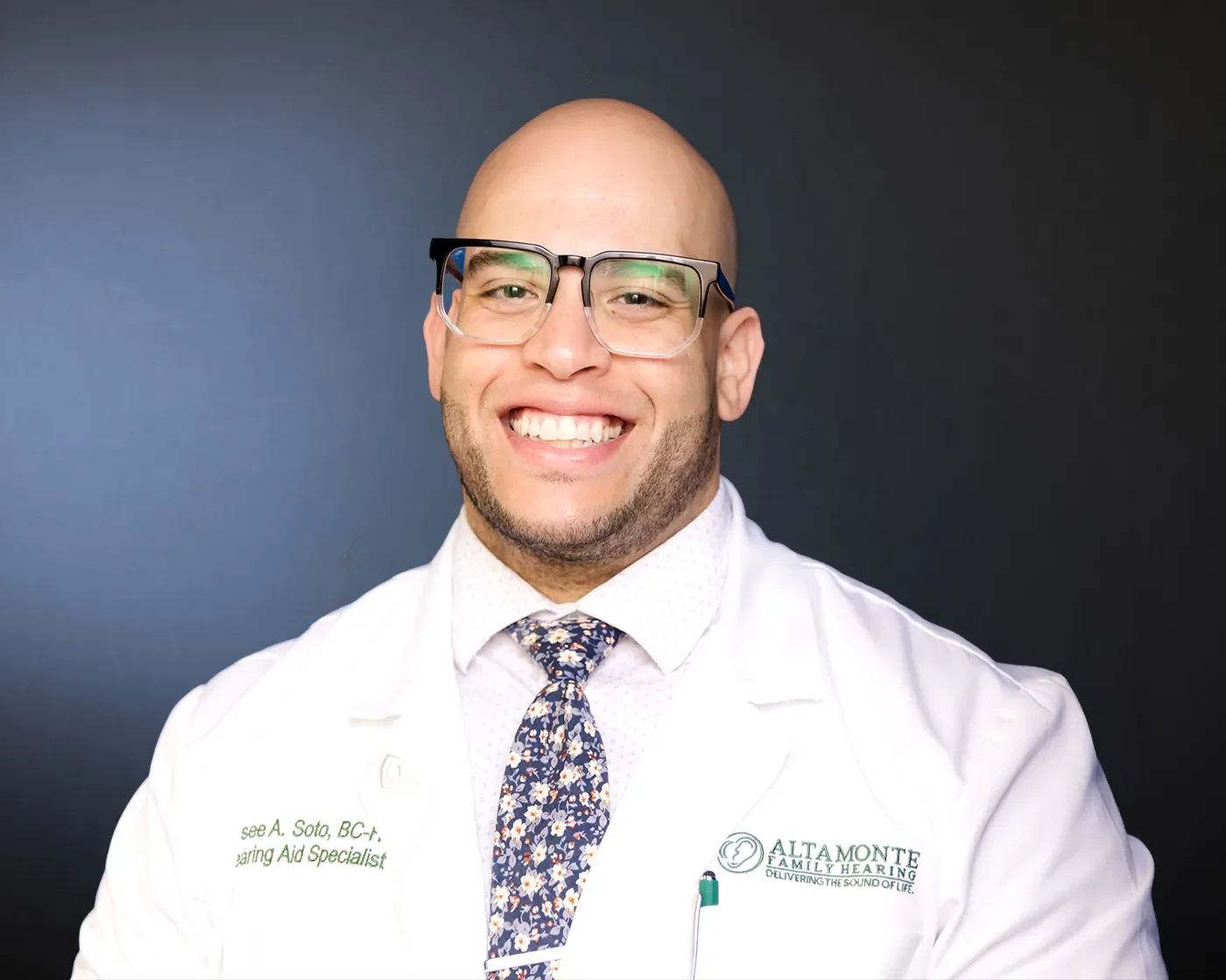 Jaysee Soto smiling in his clinic white coat