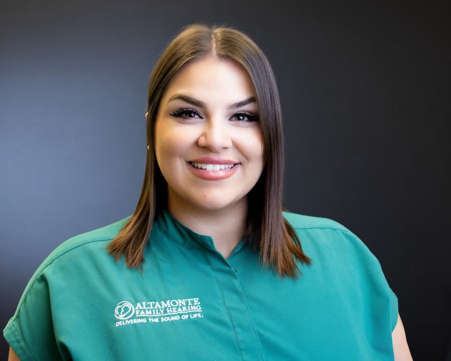 Grace Soto smiling in green clinic scrubs