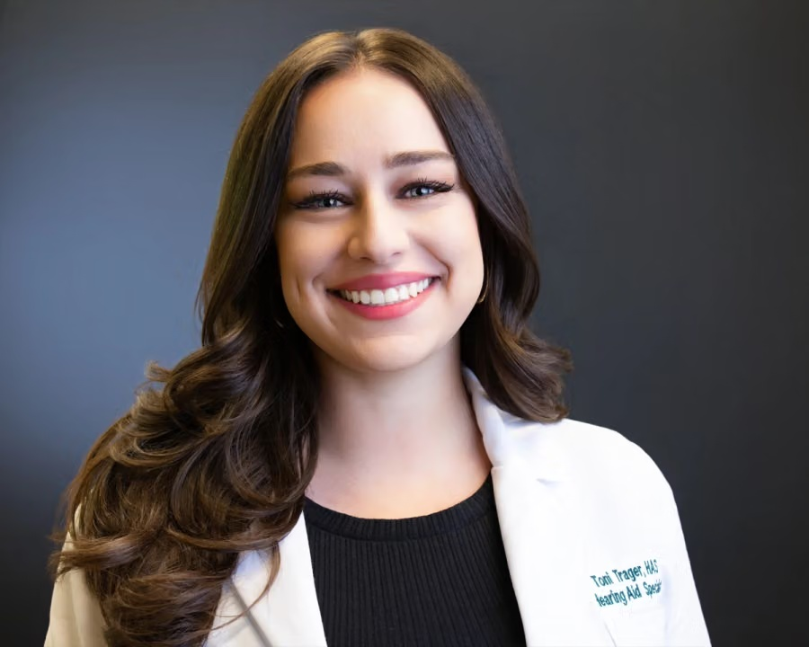 Toni Trager smiling in her clinic white coat