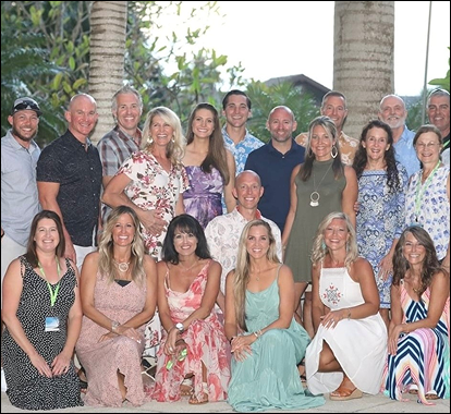 Allan and Nicole Blain hold hands while speaking on stage at a live event, delivering a message of faith, purpose, and marriage mentorship.