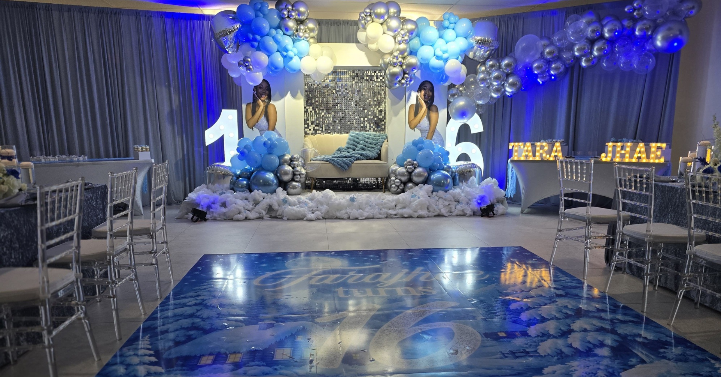 Elegant Sweet 16 birthday party setup at an event space in Lauderdale Lakes FL with balloon décor, custom dance floor, and chiavari seating