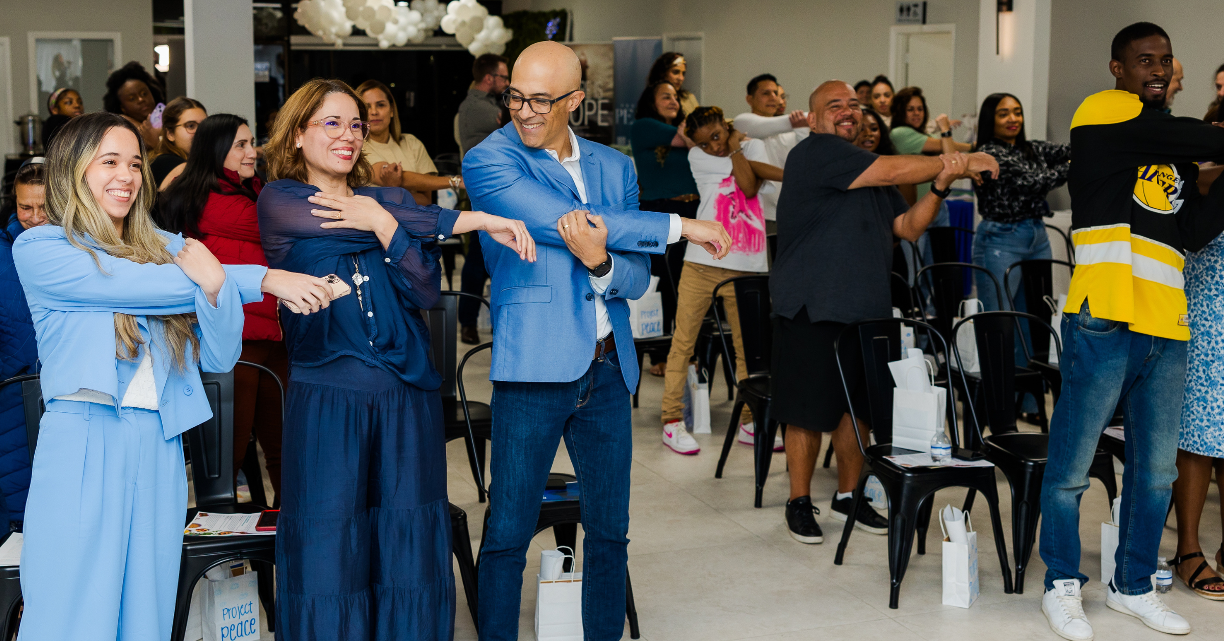 Guests participating in an interactive group activity at a corporate event inside a versatile Lauderdale Lakes event venue