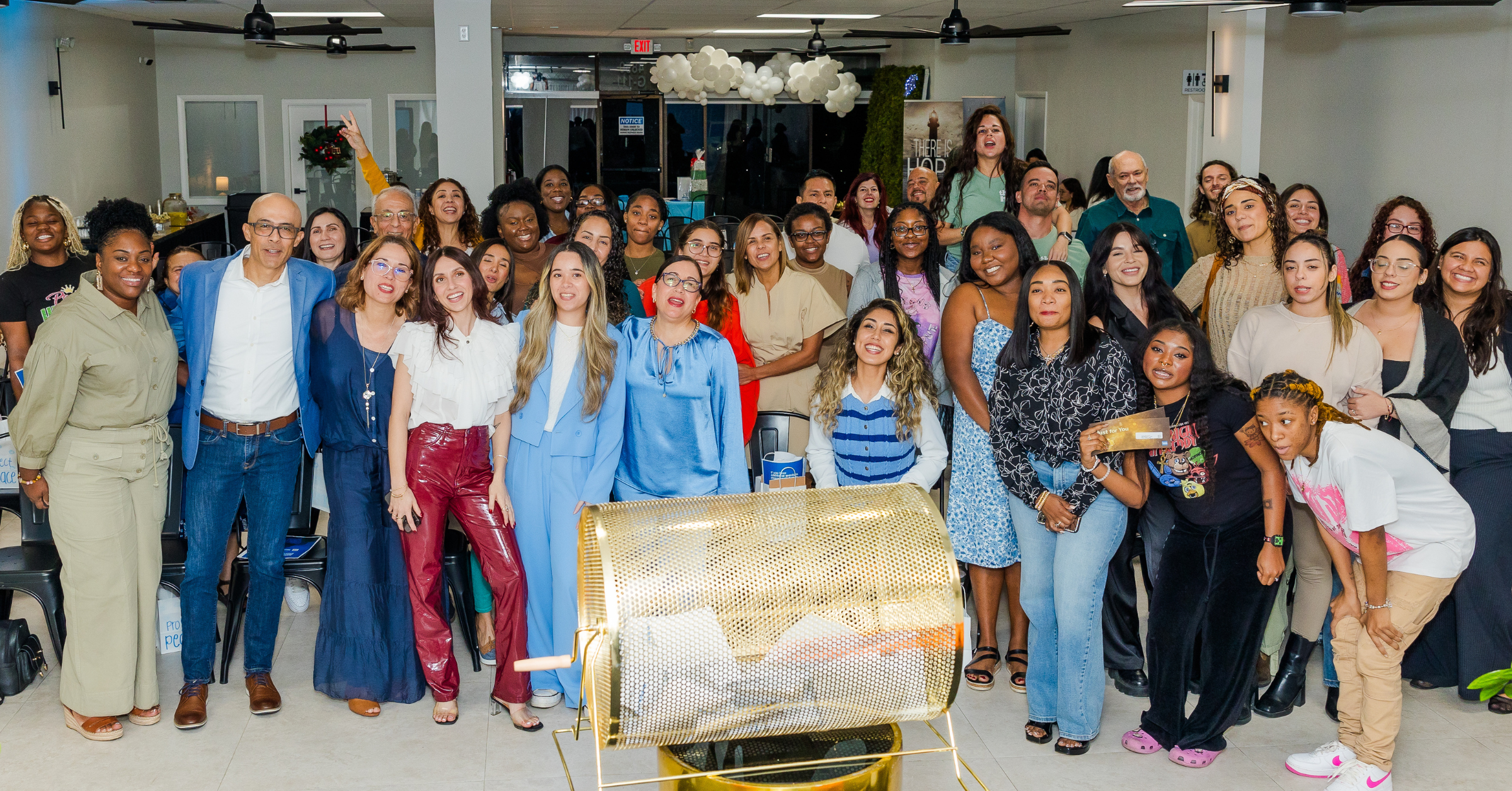 Guests gathered at event inside Born On Purpose Hub in Lauderdale Lakes FL showcasing a lively community event in a modern indoor venue