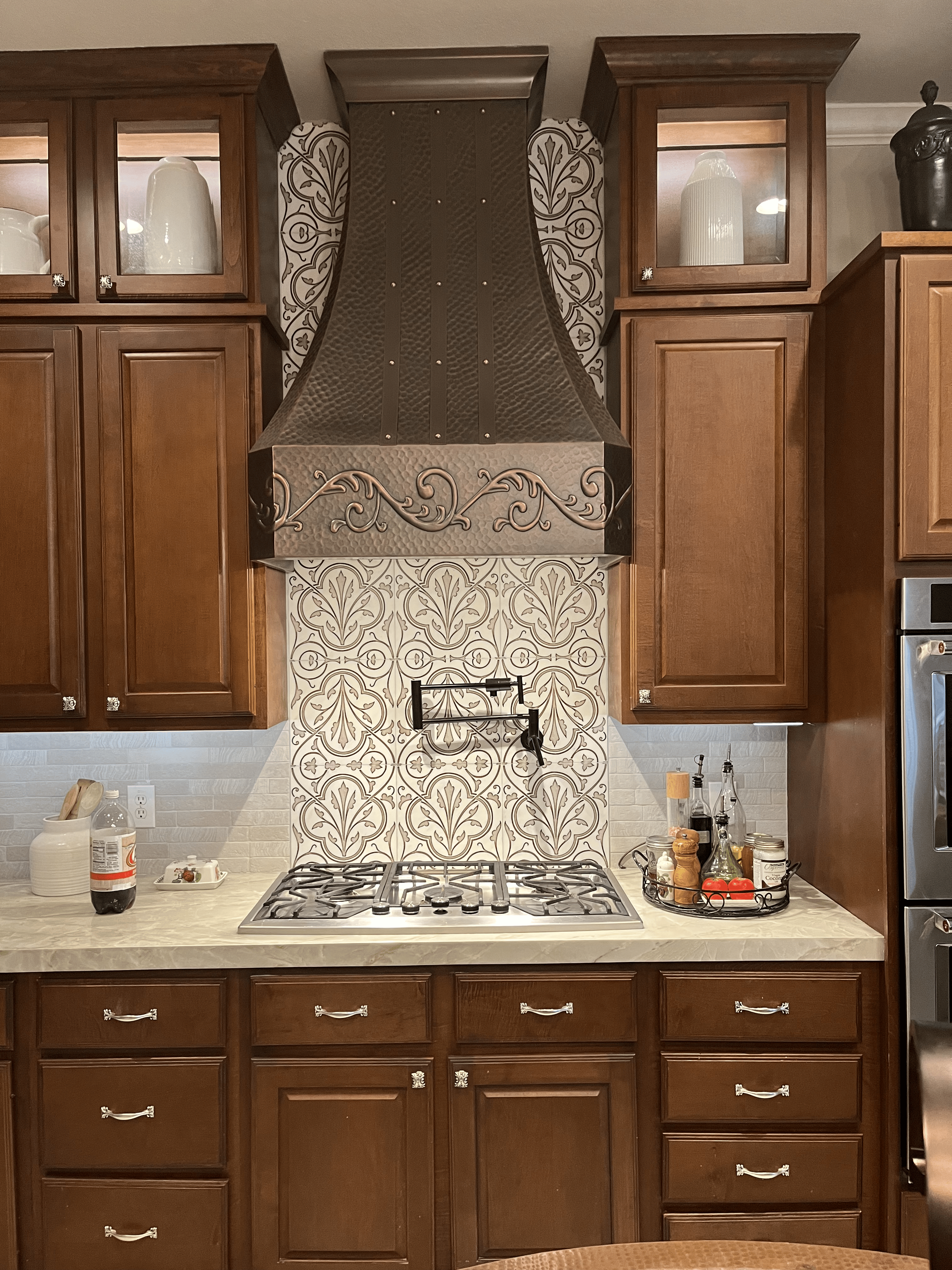 Remodeled white kitchen with island and gold hardware