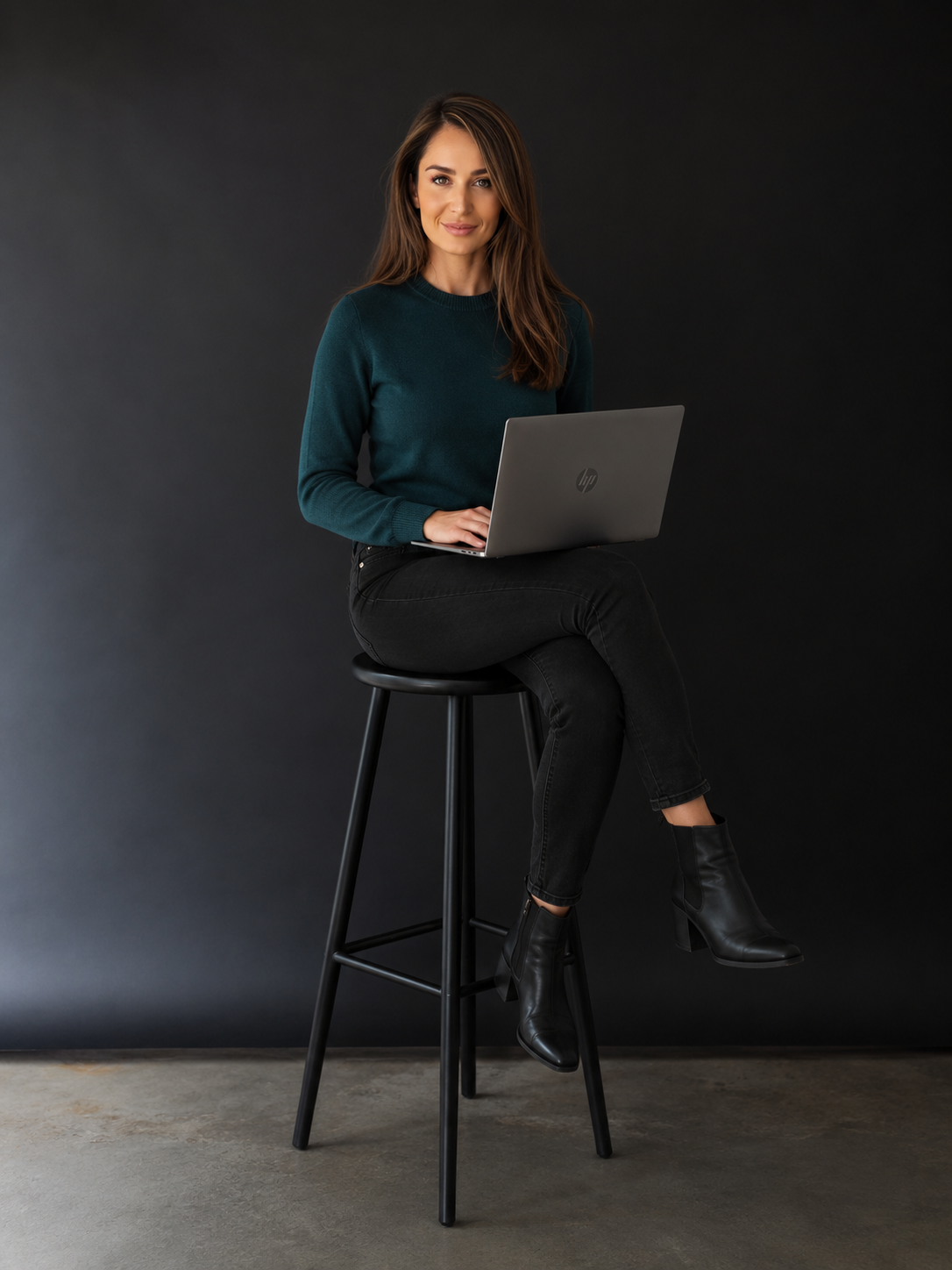Ashley Ruperto, AI and automation consultant, working on her laptop