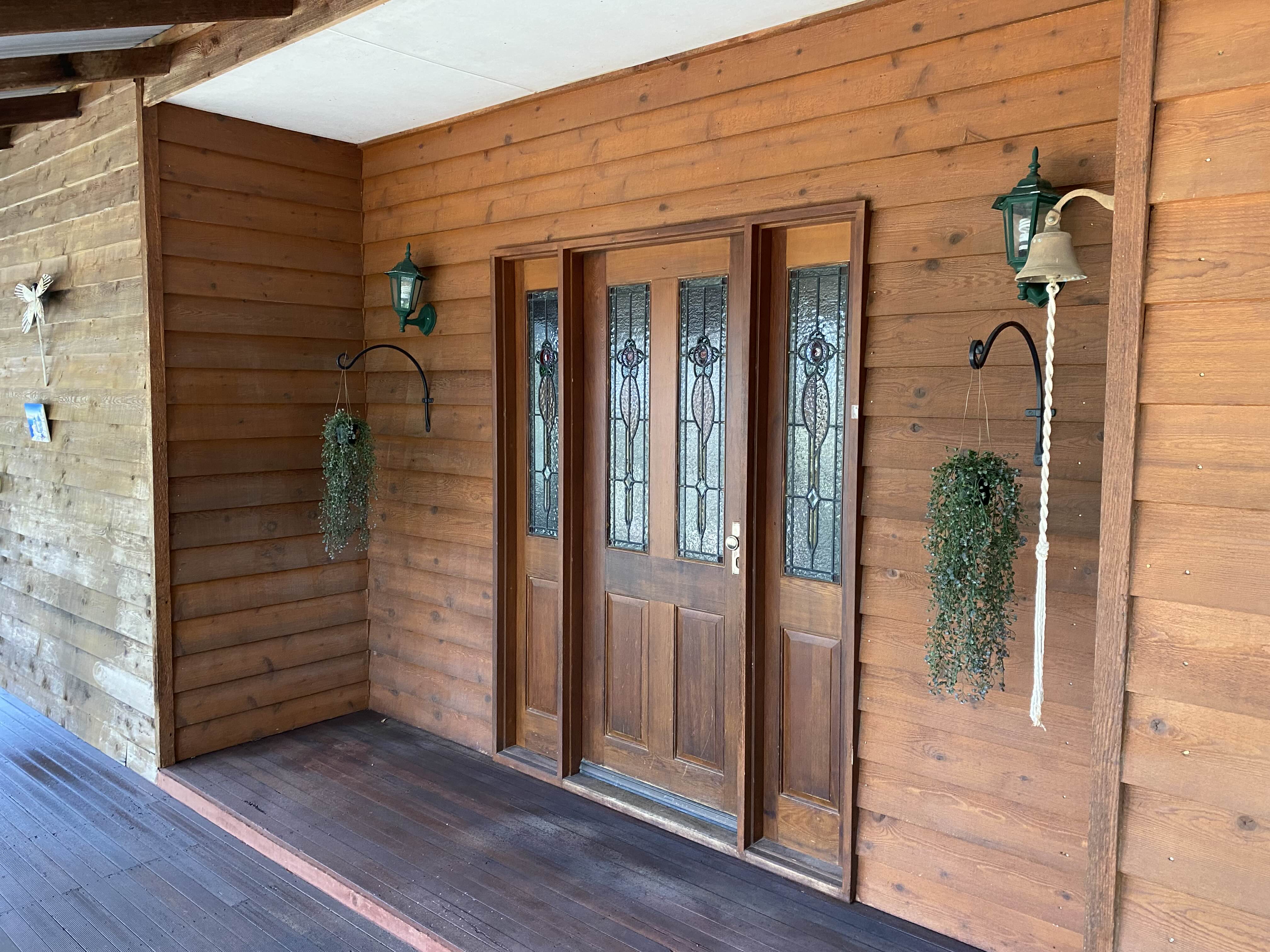 A Perth home with timber cladding and decking after soft washing
