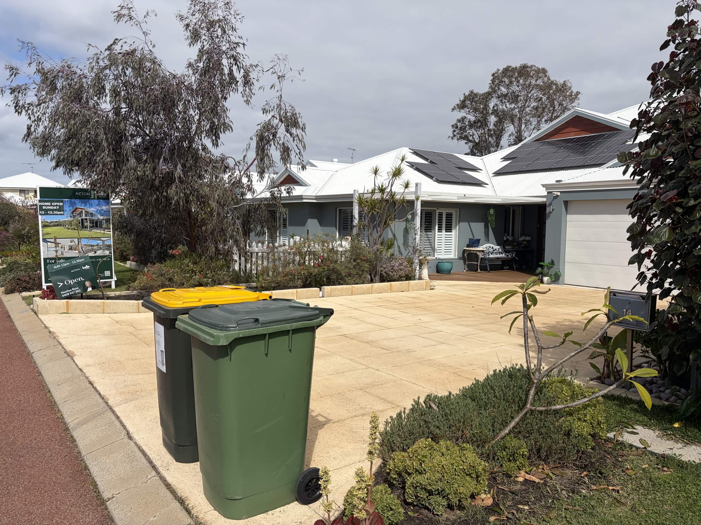 A Perth home on the market with the home open sign out the front