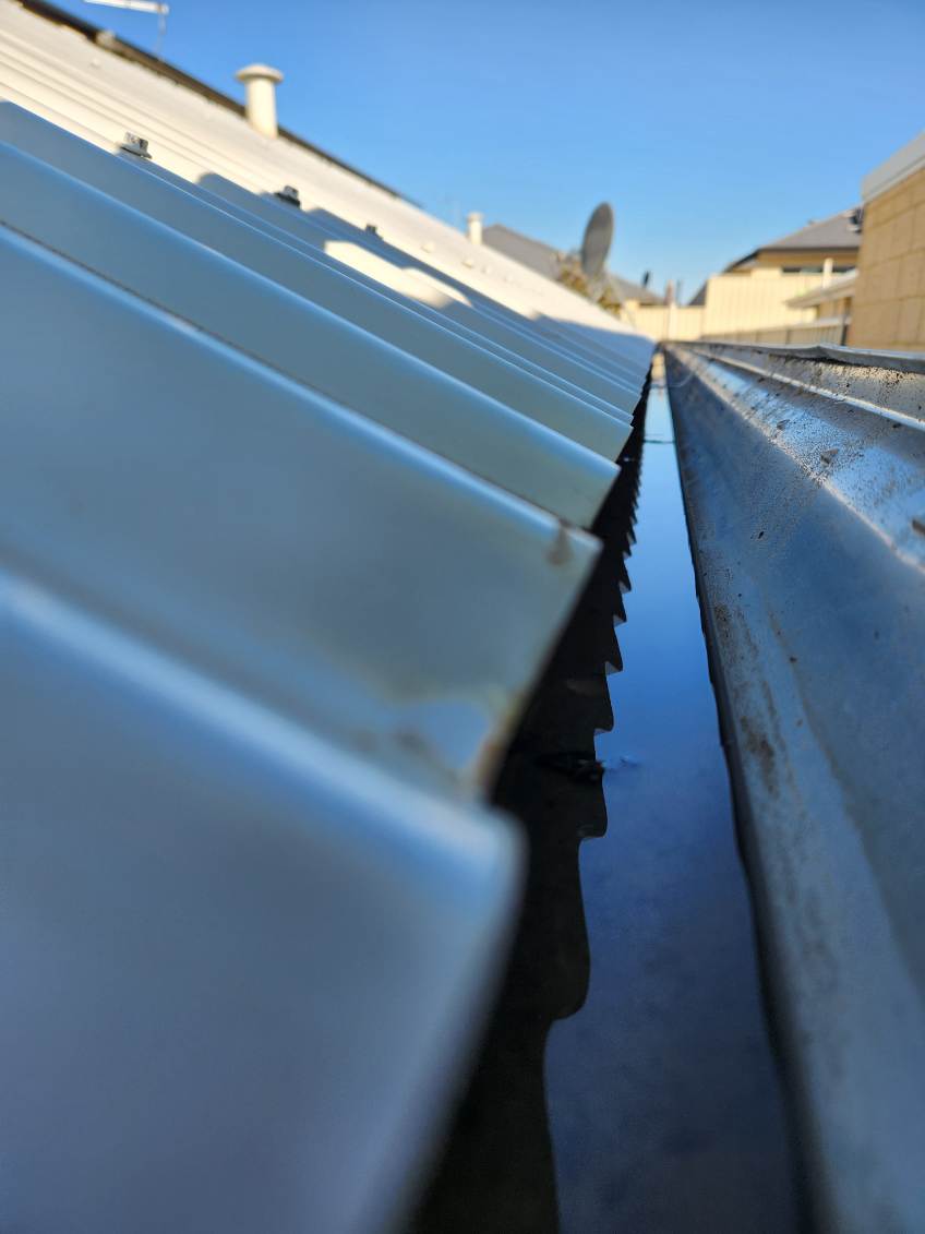 A Perth gutter cleared out and running clear