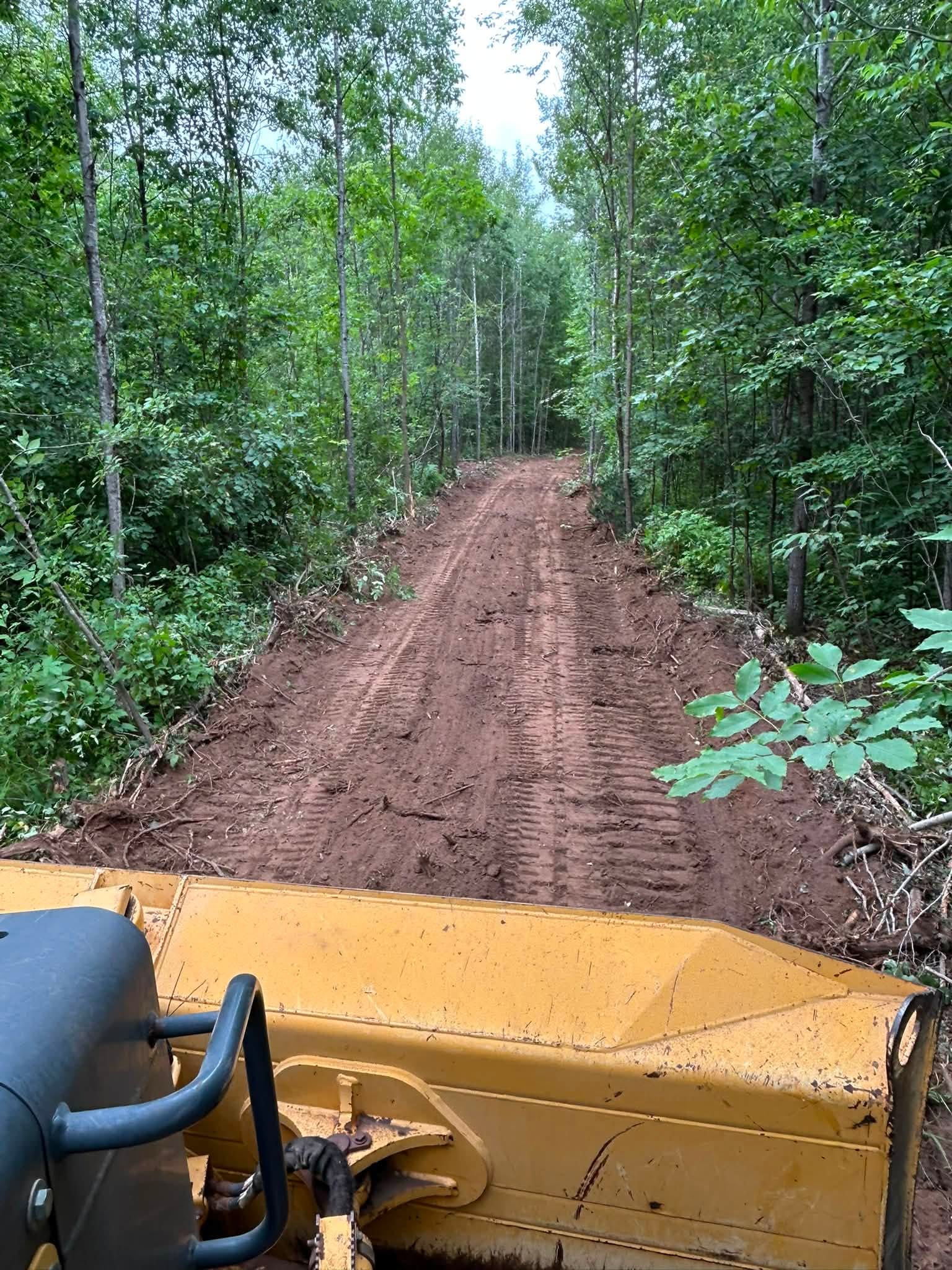 Finished smooth-graded ATV and UTV trail through Wisconsin woods