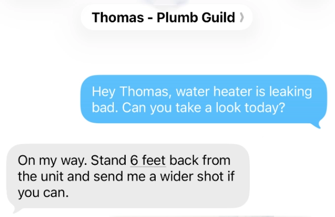 iPhone text message thread to Thomas at Plumb Guild with a photo of a leaking water heater