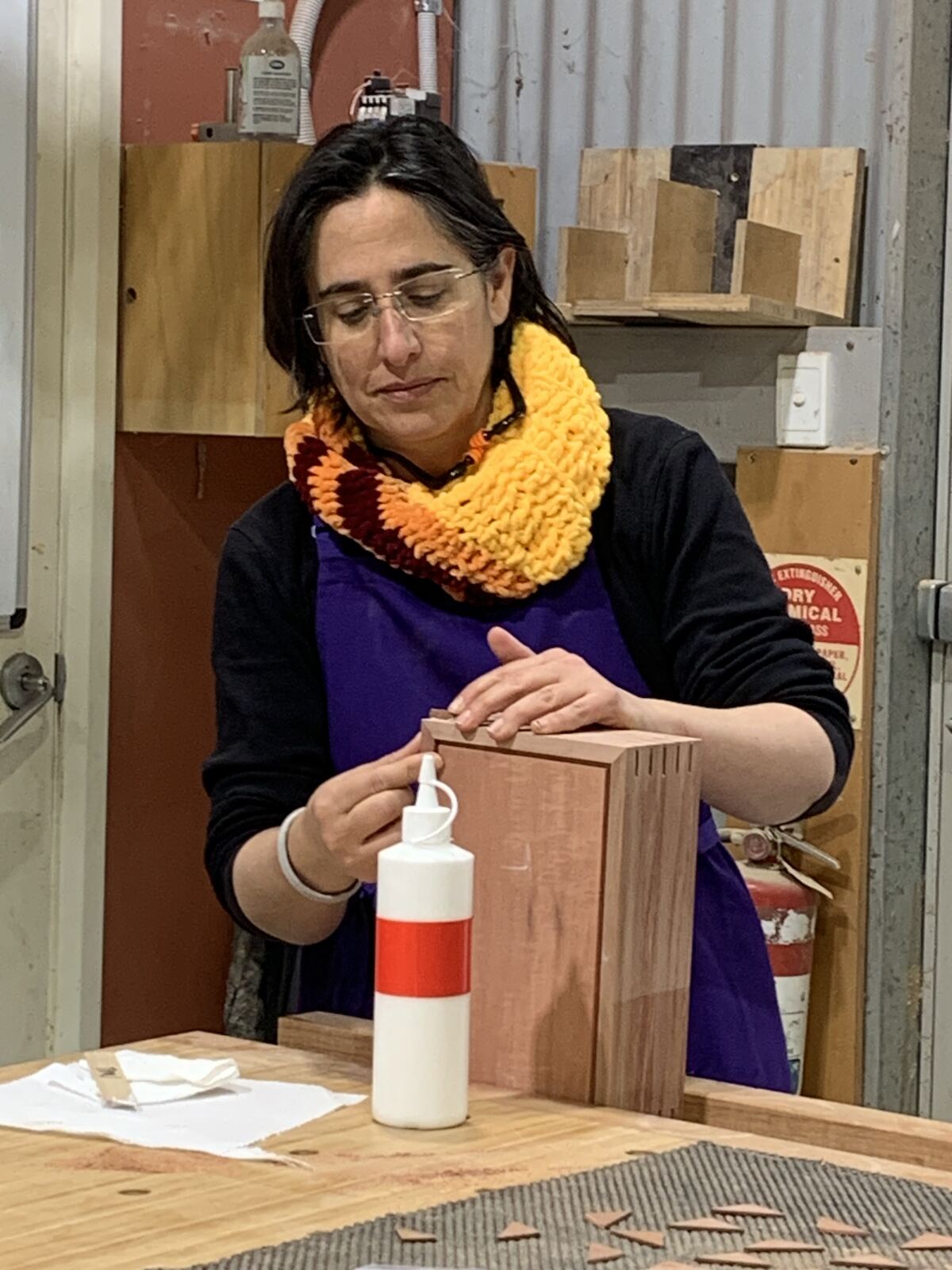 An attendee gluing her finger-jointed box