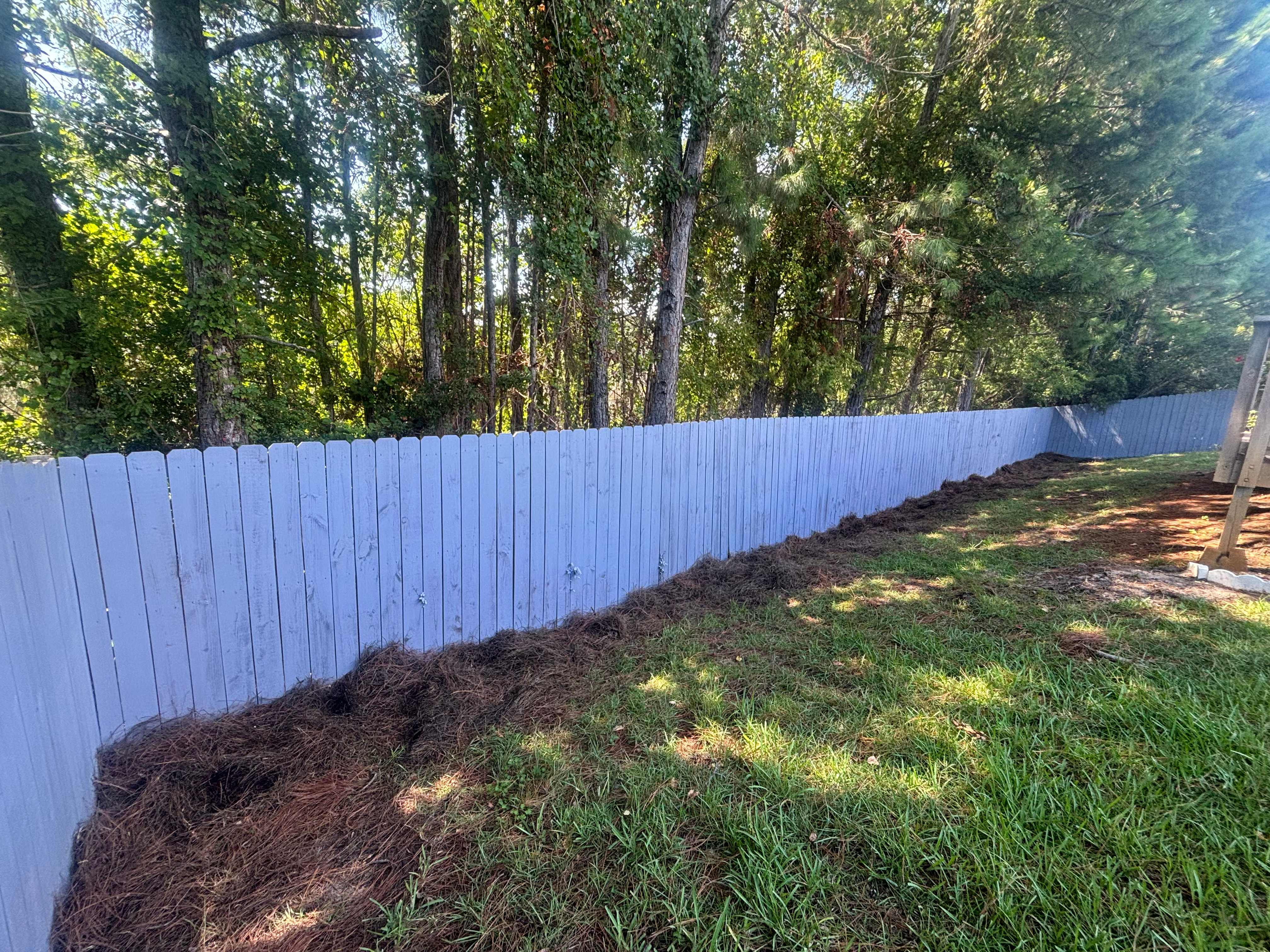 Freshly painted wood privacy fence in Walton County FL