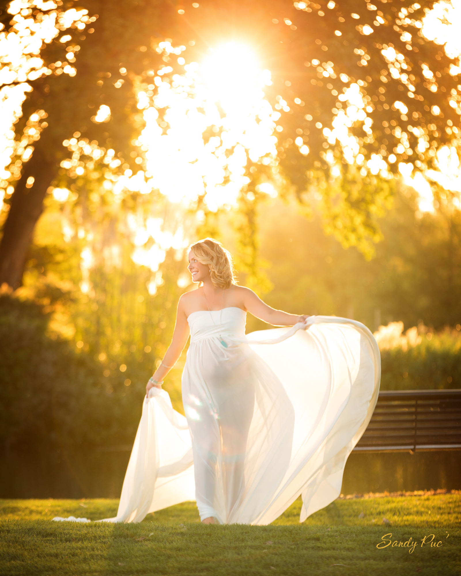 Glowing expectant mother in an airy maternity photography session
