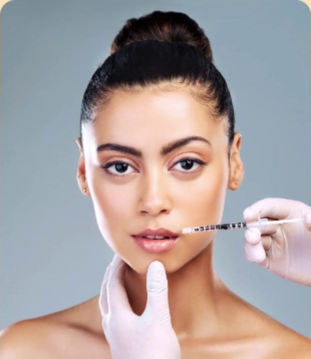 A dermal filler treatment being applied to the lips