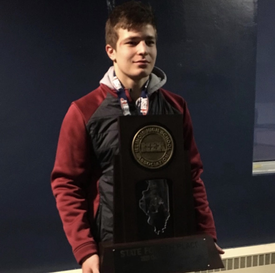 Chad holding the IHSA state fourth place team trophy