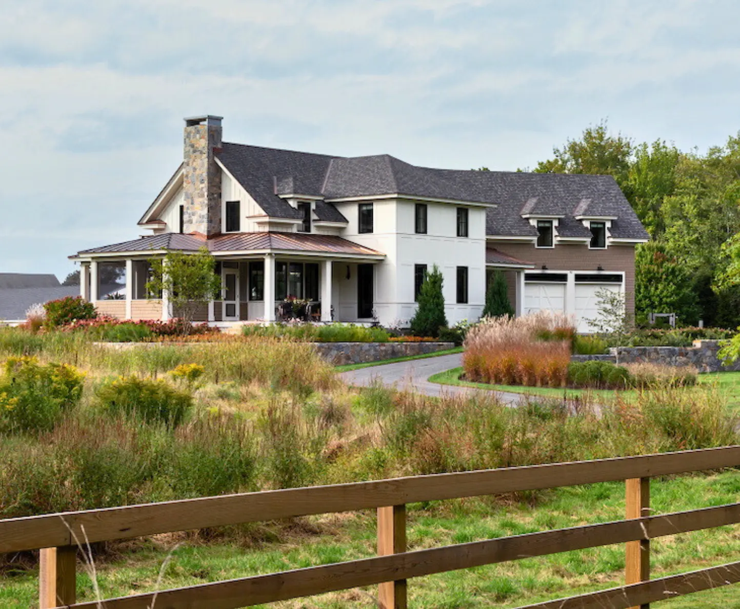 Exterior house painting by Minute Men Painters in Portsmouth, New Hampshire featuring a modern home with landscaped grounds