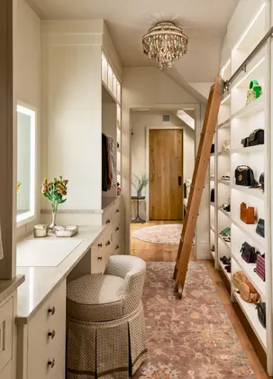 Interior painting by Minute Men Painters in Portsmouth, New Hampshire featuring a custom walk-in closet with built-in shelving