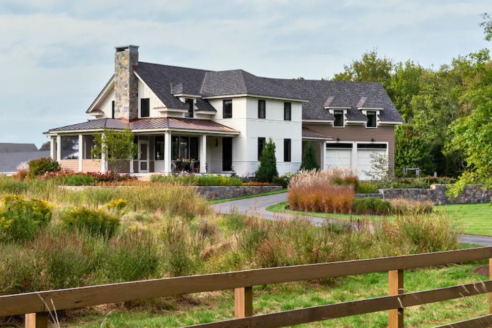 Exterior house painting by Minute Men Painters in Portsmouth, New Hampshire featuring a modern home with landscaped grounds