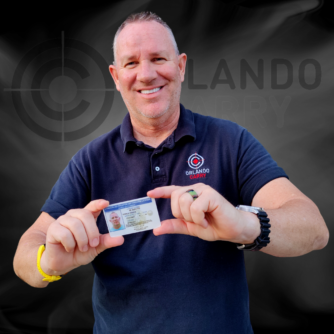 NRA Firearms Instructor Craig Schield hold a Florida Concealed Weapon or Firearm License
