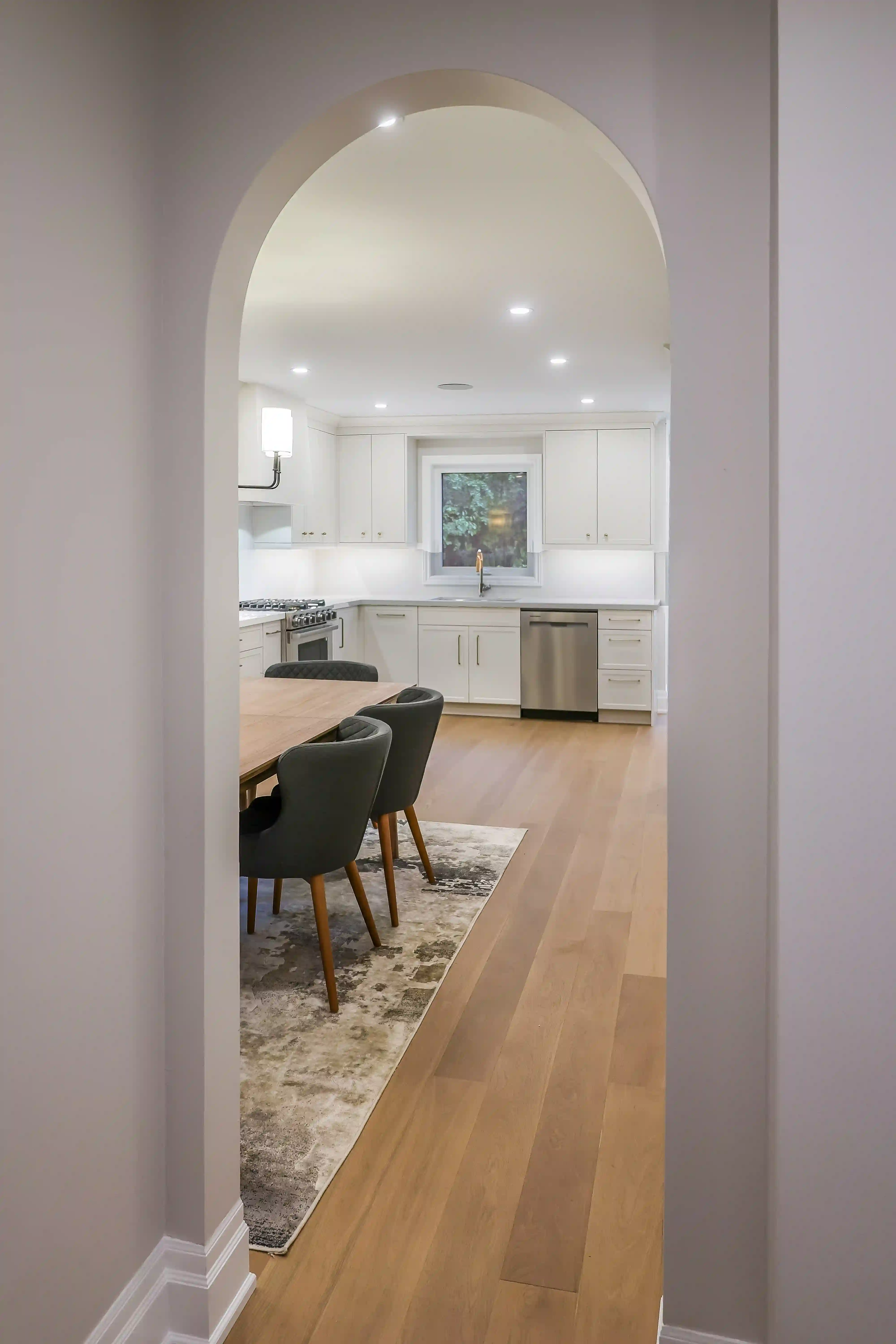 Arched opening to kitchen and dining area