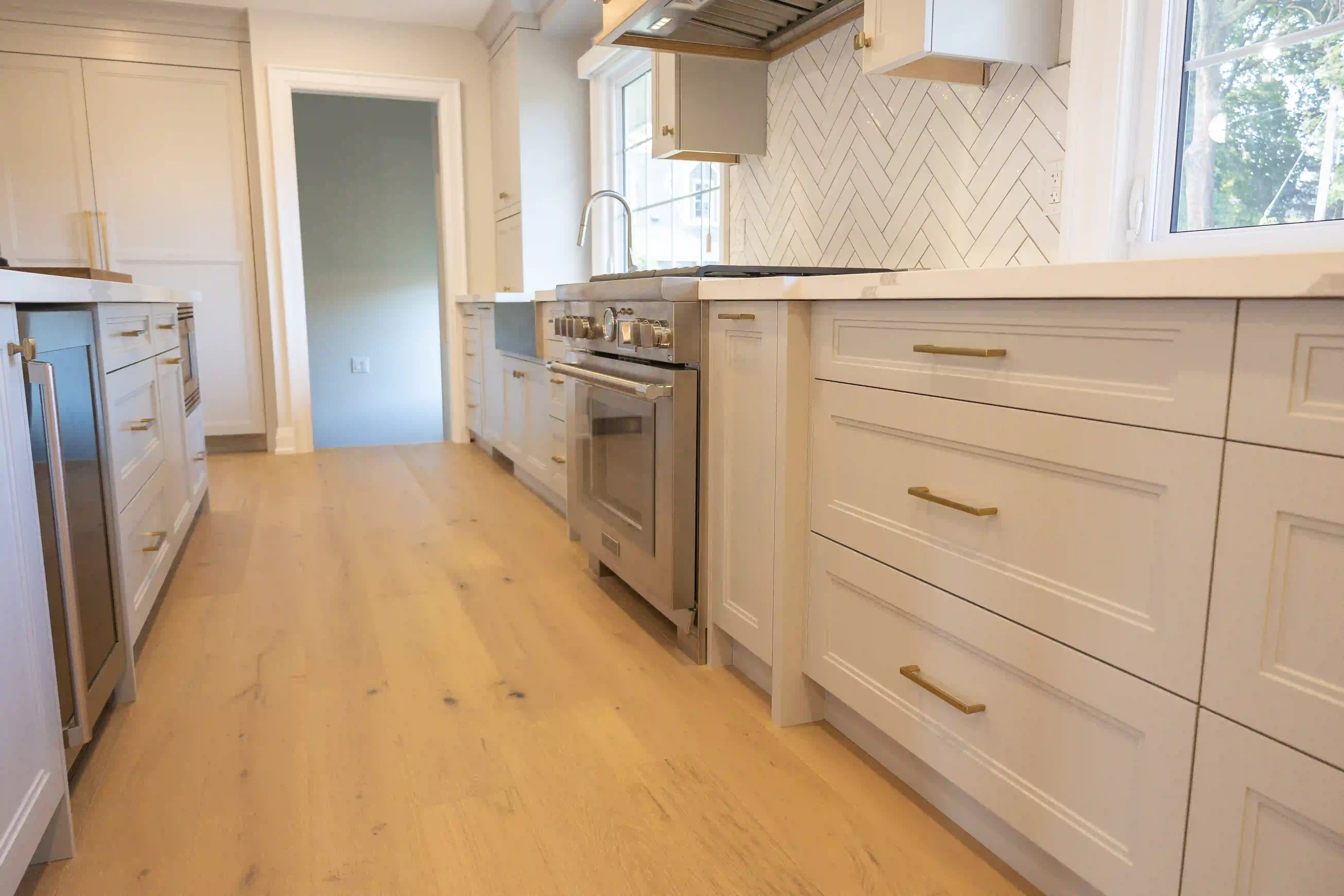Long kitchen counter and hardwood flooring