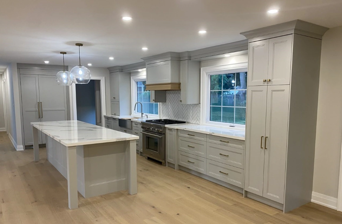 Kitchen island, range wall and paneled refrigerator