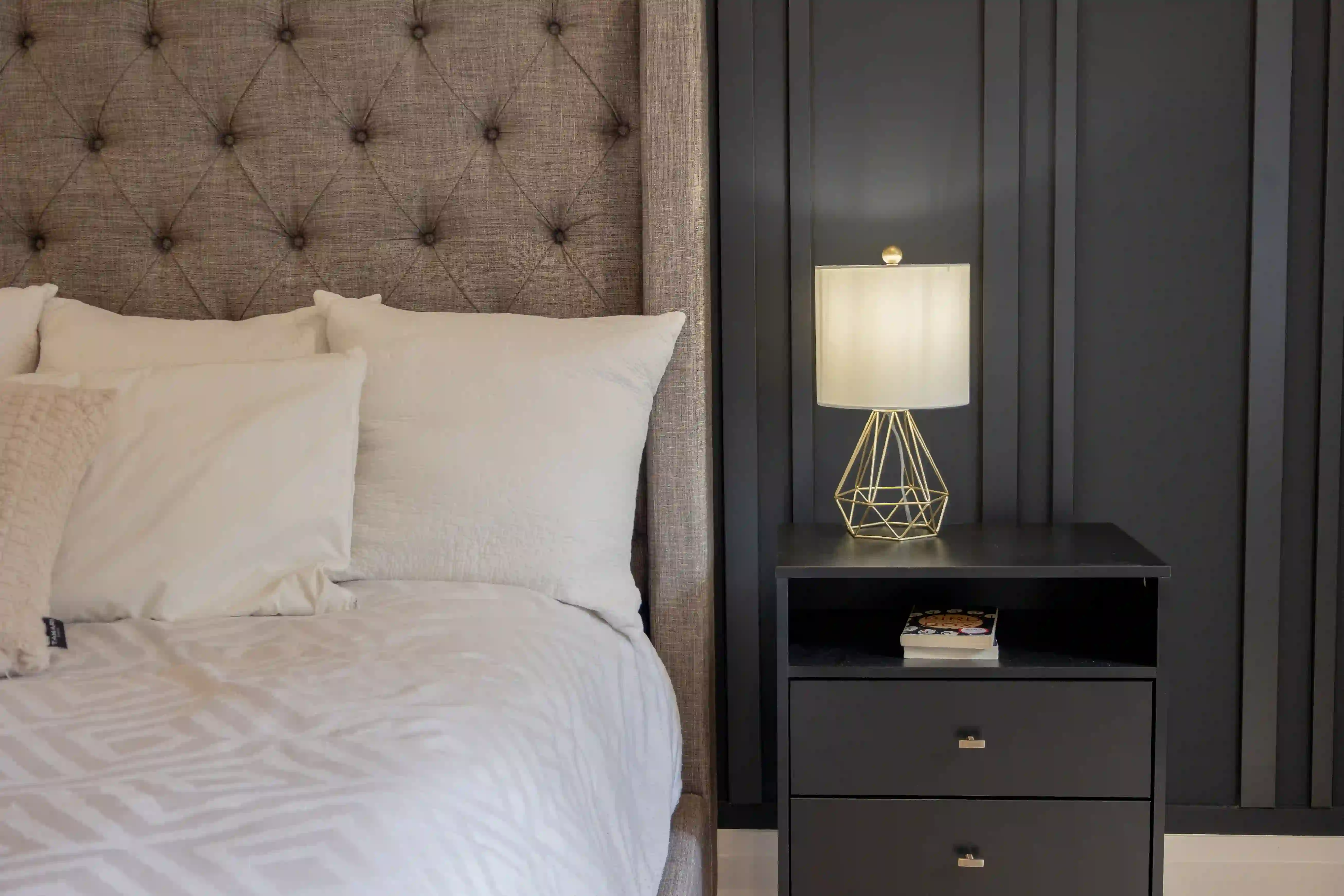 Primary bedroom detail and paneled headboard
