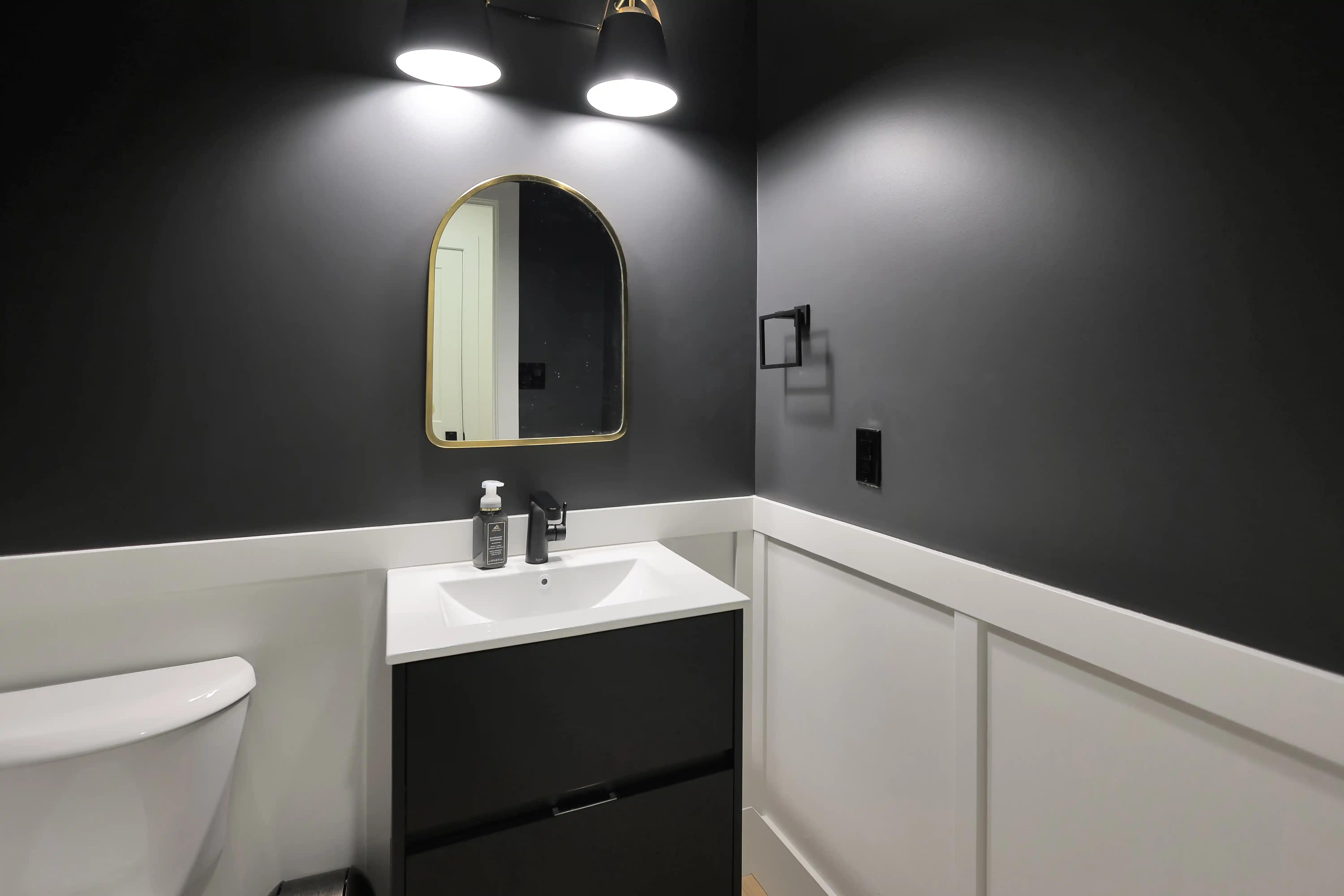 Powder room with black walls