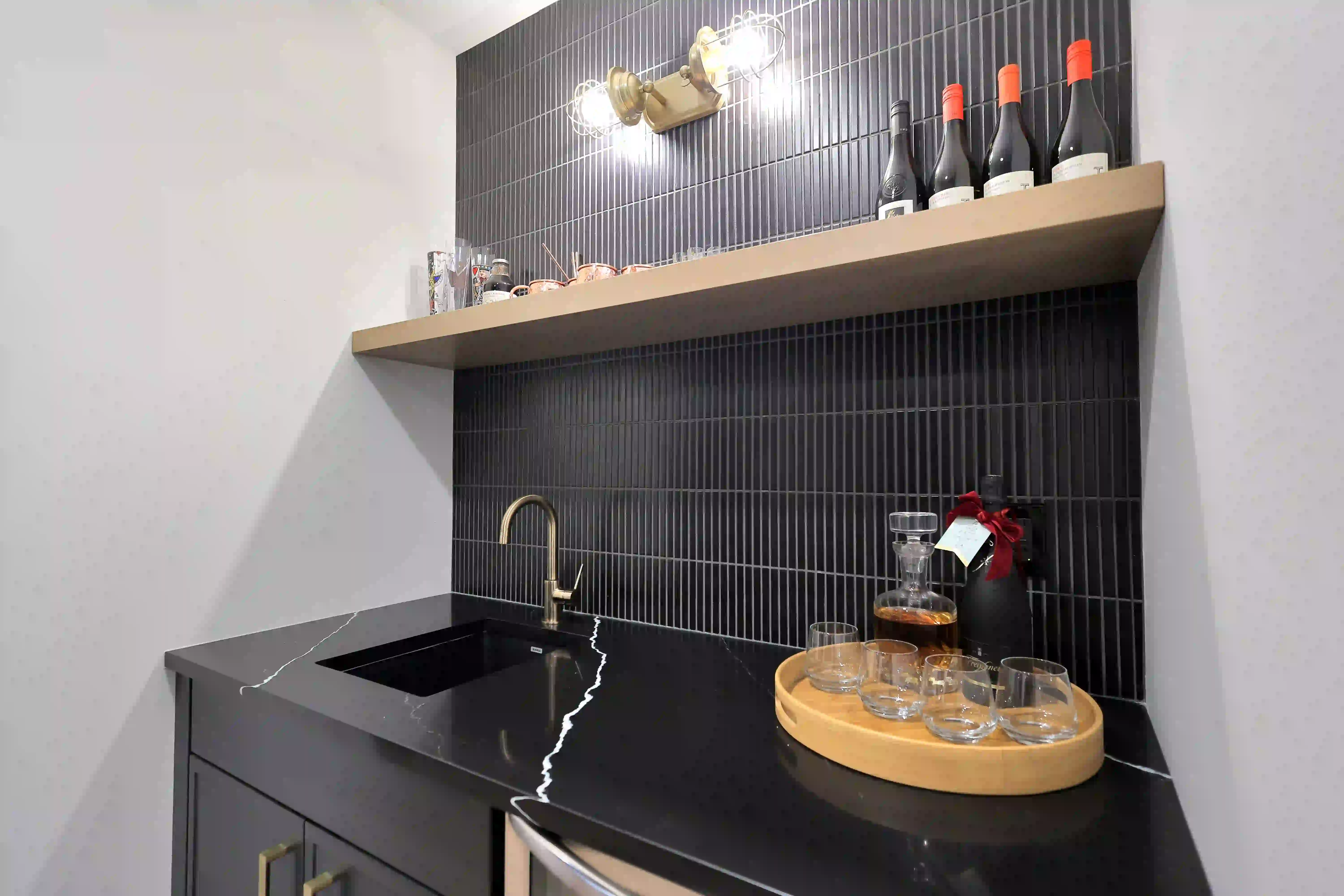 Built-in wet bar with black tile