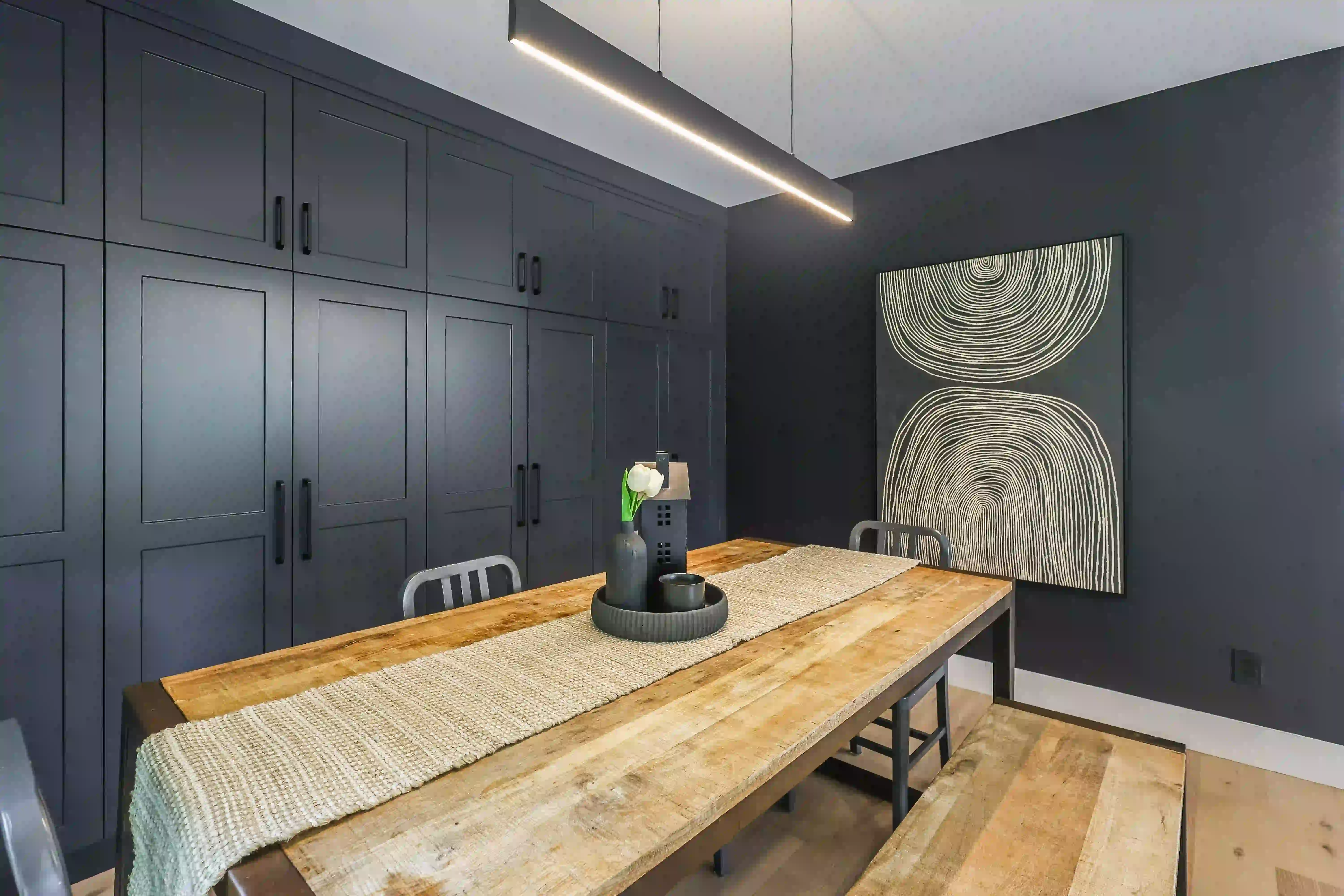 Dark dining room with built-in cabinetry